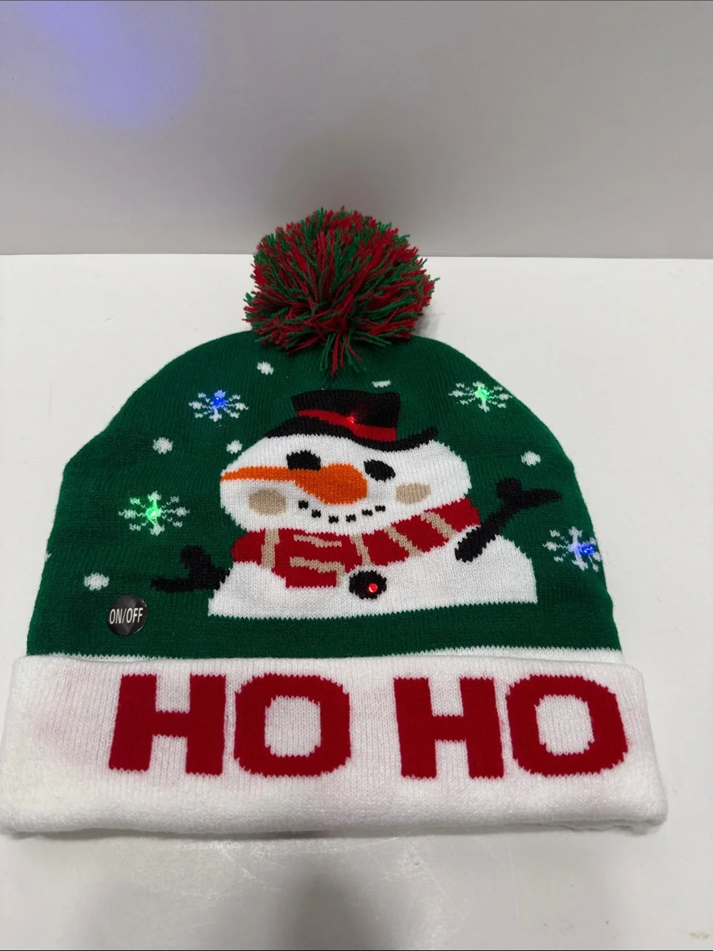 Green Holiday Light Up Snowman Pom-Pom Beanie Hat with 'HO HO' Cuff